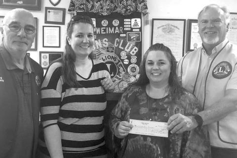 WEIMAR BAND GETS DONATION FROM LIONS