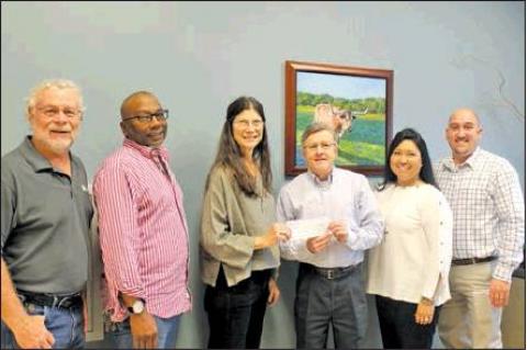 Industry State Bank donates to Deputy Santa, Habitat for Humanity
