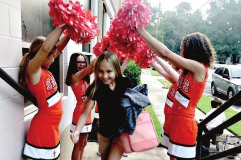 SAS cheerleaders welcome students