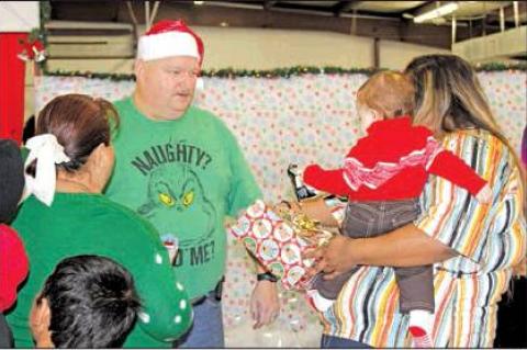 Deputy Santa distributes toys