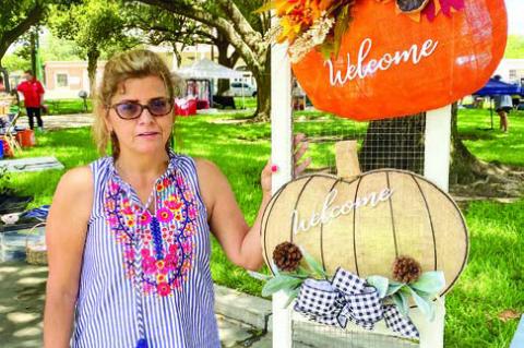 Gloria Palmberg, of Gloria’s Crafts, shows off the pumpkin décor items she had for sale at her booth at Saturday’s Market Days in Columbus. She said the attendance for Saturday’s event was about average but expects it to pick up for the next couple