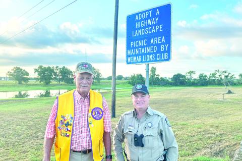 Pictured at Borden Lake are 1st District Vice President Julius Bartek, a Weimar Lion, and Officer Kohleffel. Courtesy photo