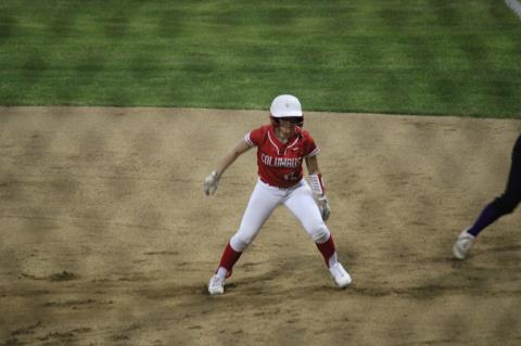 Kaylea Foster considering stealing second base before retreating back to first.