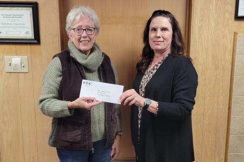Funds donated by members of Fayette Electric Cooperative were donated to the Mini Horse Helpers. Pictured from left are Mini Horse Helpers Vice President/Executive Director Sally Van Duyn and Fayette Electric Cooperative Marketing and Training Coordinator