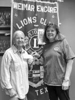 LIONS CLUB DONATES TO LIBRARY